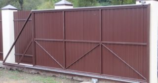 Купить откатные ворота из профнастила Кингисепп, цена от 1785 руб.