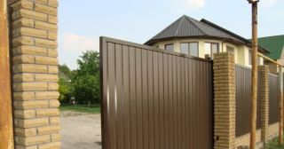 Купить откатные ворота из профнастила Кингисепп, цена от 1785 руб.